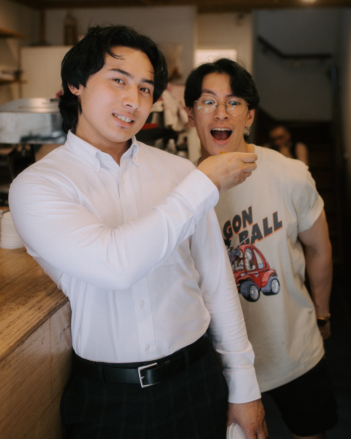 Khairi Johari feeding a snack to a friend labelled "Your Business"