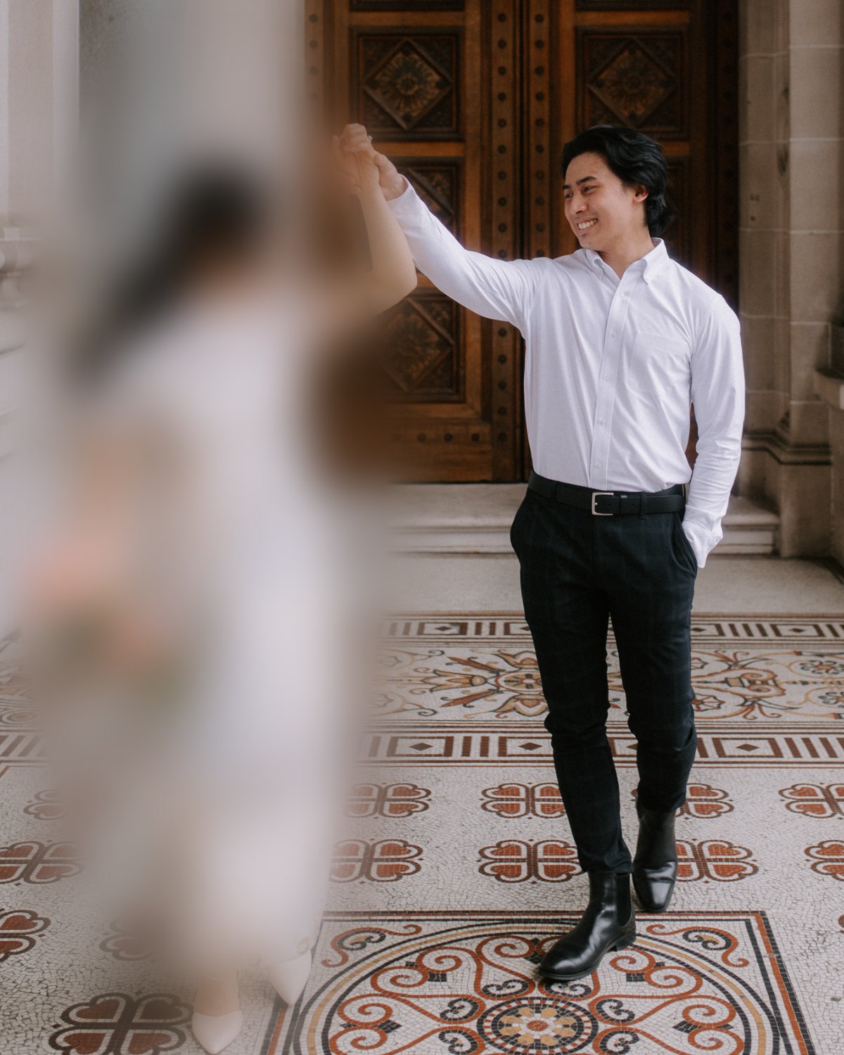Khairi Johari holding hands with a blurred figure labelled "Your Business"